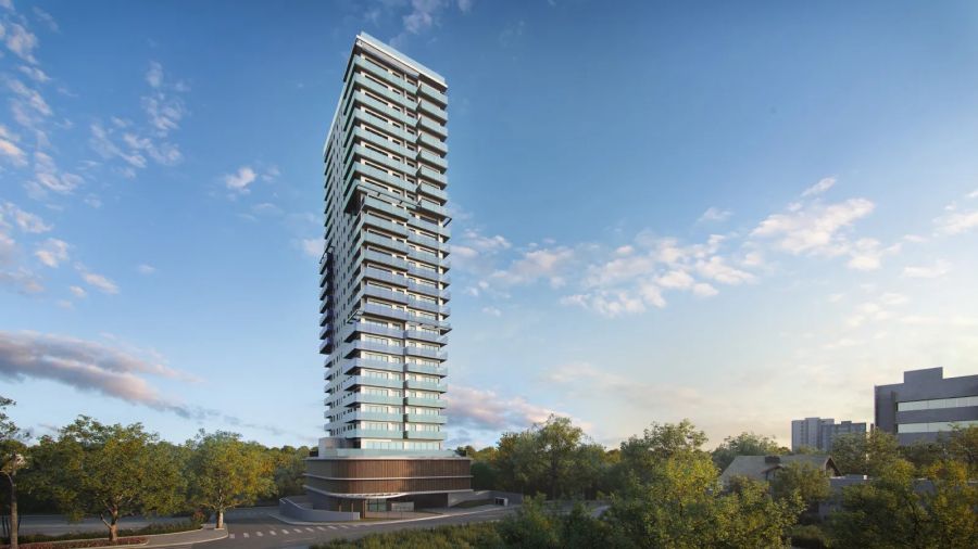 Fachada da torre residencial vista da rua sob céu azul