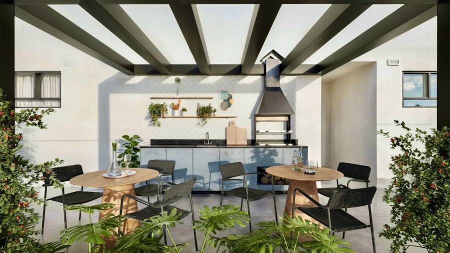 Churrasqueira do espaço gourmet com pérgola e mesas ao ar livre